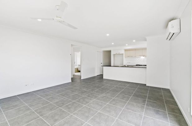 YOUR NEW FAMILY HOME AWAITS YOU! - Photo 1