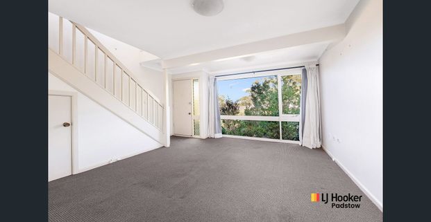 Spacious Two-Bedroom Townhouse in Peaceful, Convenient Location - Photo 1