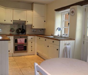 An attractive semi-detached Cotswold stone cottage conveniently sit... - Photo 1