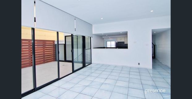 BEACHFRONT LIVING IN THIS SPACIOUS AND TIDY RESIDENCE - Photo 1