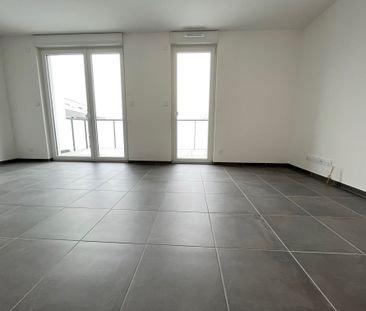 Location Appartement HUNINGUE 613 € CC - Photo 1