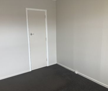 This generous two-bedroom unit offers an open-plan living area, two... - Photo 4