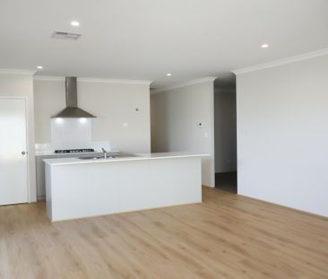 Live the Coastal Lifestyle in Brand New Four Bedroom Home! - Photo 1