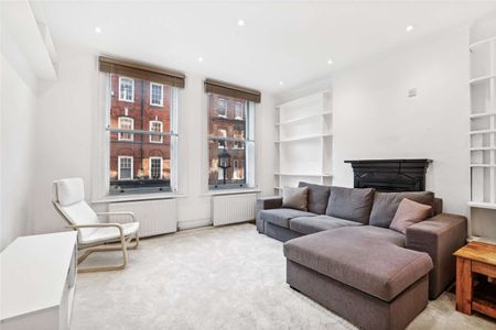 A charming 1 bedroom apartment with original hard wood floors, in this central and sought after location - Photo 4