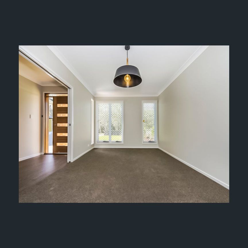 Large Family Home with Spacious Backyard! - Photo 1