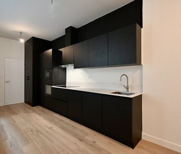 KARAKTERVOL GELIJKVLOERS APPARTEMENT MET STADSTERRASJE - Photo 6
