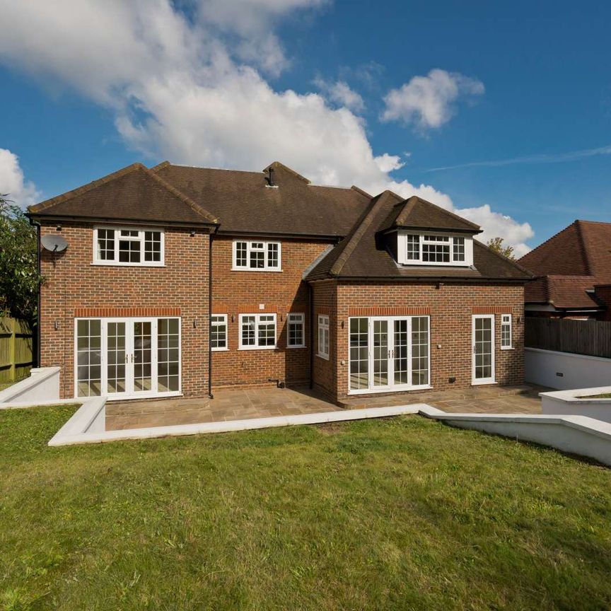 A large five bedroom detached family home with a garage in a very sought after location near Guildford main line station and the the centre of Guildford. - Photo 1