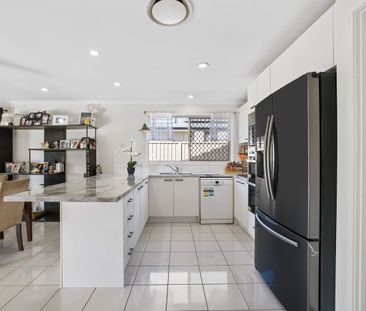 The Brief:Affordable Family Home in Helensvale: 4 bedrooms. Solar w... - Photo 4