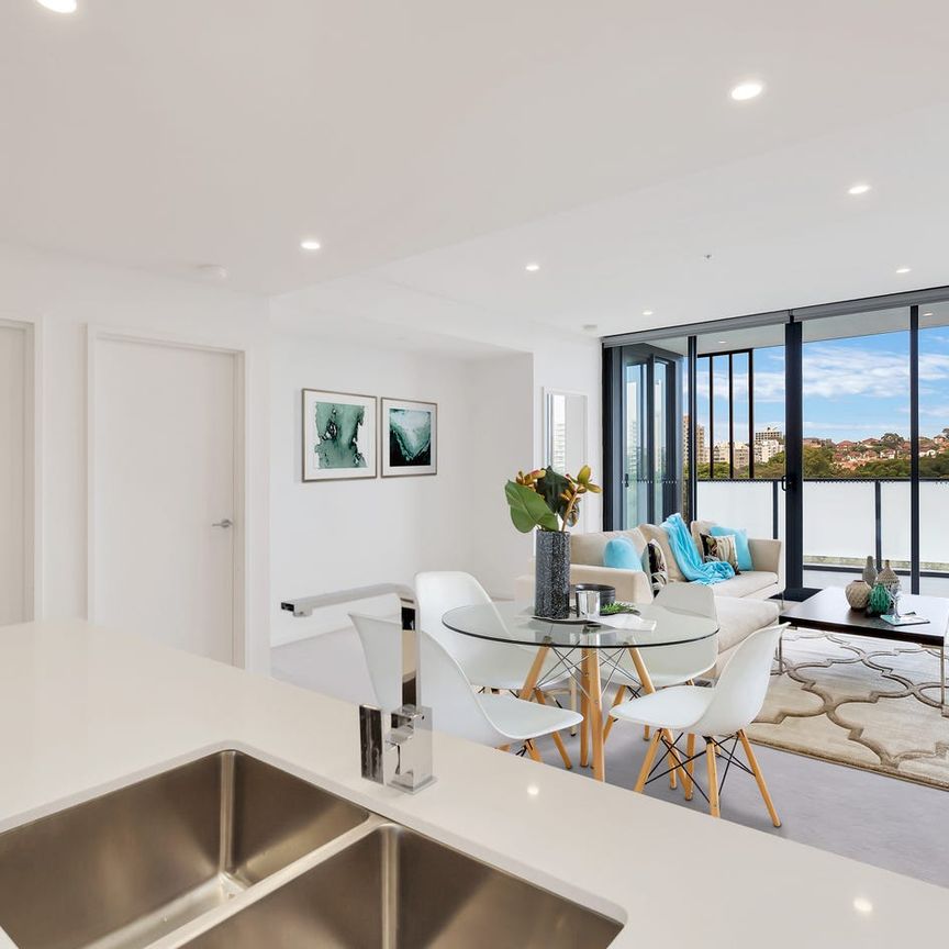 Convenient living above East Village Shopping Centre - Photo 1