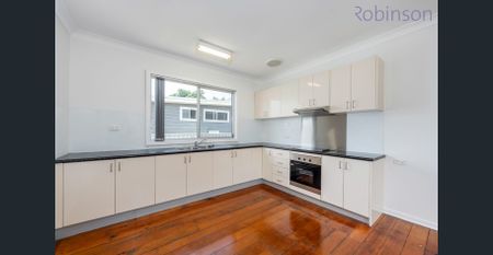 Freshly painted three bedroom home with air-conditioned living space and off street parking. - Photo 5