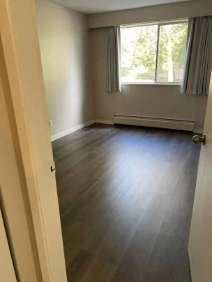 Parkside Apartments — CLOSE TO RCH & SKYTRAIN 1 Bedroom Suites Available - Photo 1