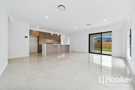 Few Homes will Compare - Ducted Air Conditioning - Multiple Living Zones! - Photo 2