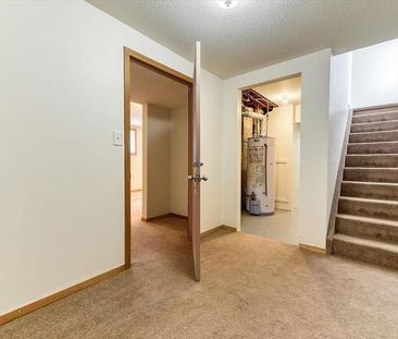 Basement suite with 1 bedroom, 1 full bath, and a kitchenette area | 79 Abalone Way Northeast, Calgary - Photo 1