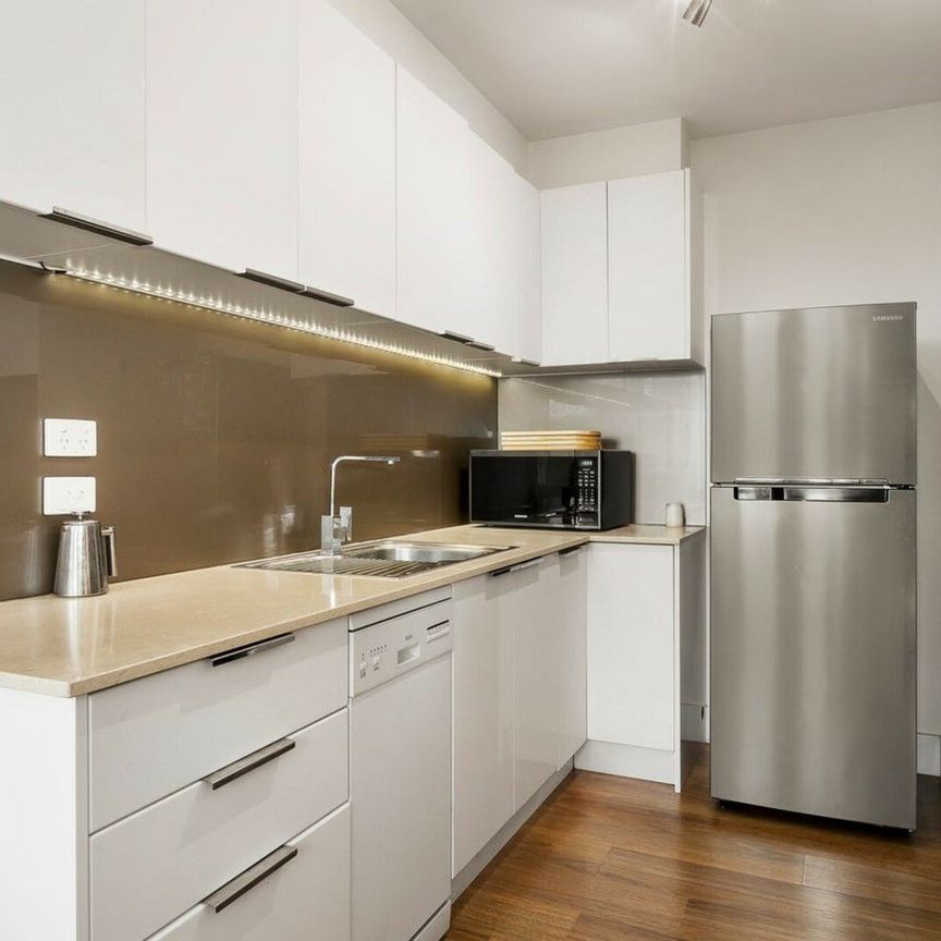 GROUND LEVEL APARTMENT WITH HUGE COURTYARD - Photo 1