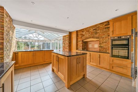 A five-bedroom detached family home situated in Wendover, benefiting from ample driveway parking and both a double and single garage. - Photo 4