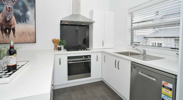 Located close to town and featuring modern finishes throughout! - Photo 1