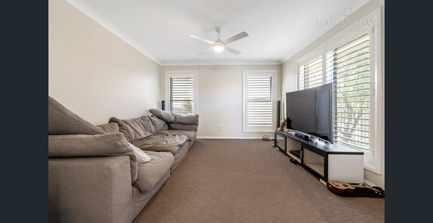 Spacious Three-Bedroom Home with Multiple Living Areas - Photo 1