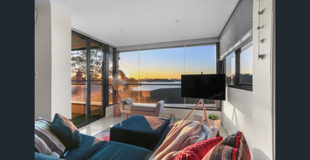 TUCKED AWAY ON THE WATERS EDGE - Photo 1