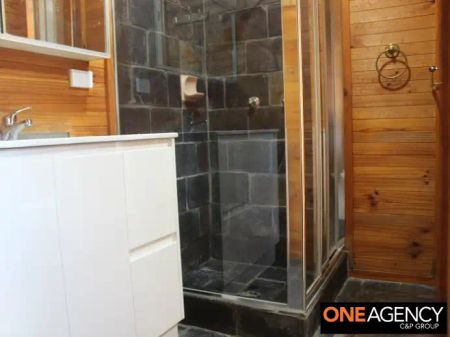 “A Charming 2‑Bed Cottage with Polished Floors & Sunlit Sunroom” - Photo 2