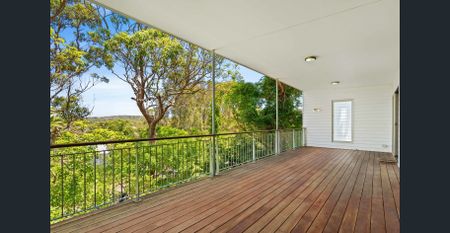 Elevated Three-Bedroom Home with Large Deck - Photo 2