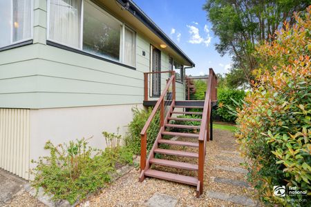 Charming Family Home with Spacious Living & Established Gardens - Photo 4