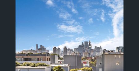 Top floor North/East facing apartment in the heart of Alexandria! - Photo 2