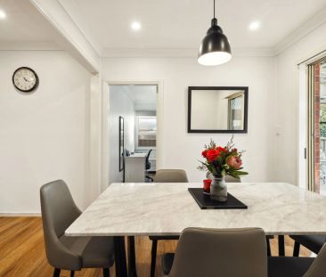 Stylishly updated north-to-rear facing home set on a tree-lined street - Photo 4