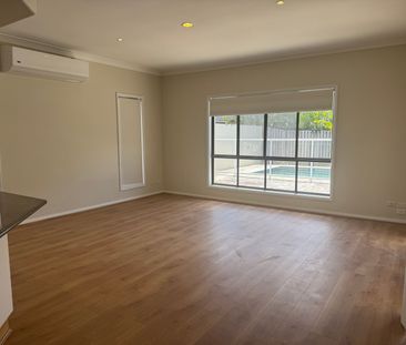 Family Friendly Four Bedroom Home located in Robina with Security Gate - Photo 3