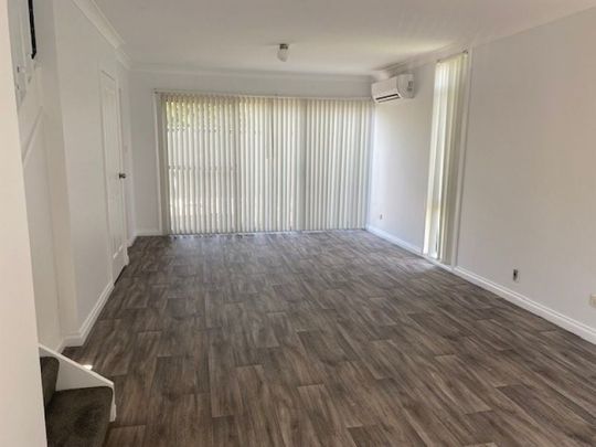 Two Bedroom Townhouse in Ideal Location - Photo 1