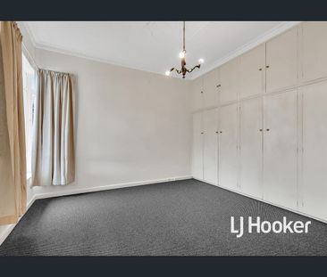 UPDATED 3 BR HOME WITH HUGE RUMPUS ROOM, & HEAT & COOL! - Photo 4