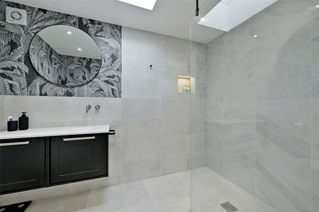 This versatile bungalow includes three bedrooms, principal with dressing room and ensuite, a stunning open plan kitchen with bi-fold doors, and a garden with a heated studio and WC. - Photo 5