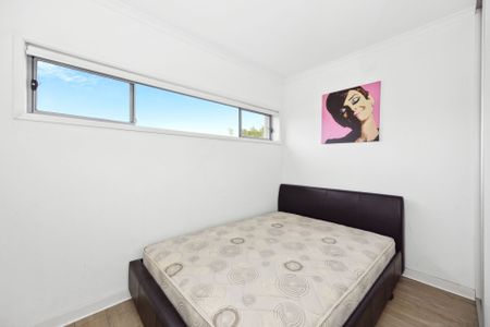 Stylish partly furnished two bedroom unit - Photo 2