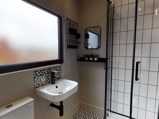 Join a stunning co-living home near the heart of the city, designed for aspirational living and vibrant community. Room E - Photo 1