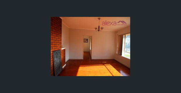 Convenient and Low-Maintenance Living: A Charming 3-Bedroom Brick Home - Photo 1