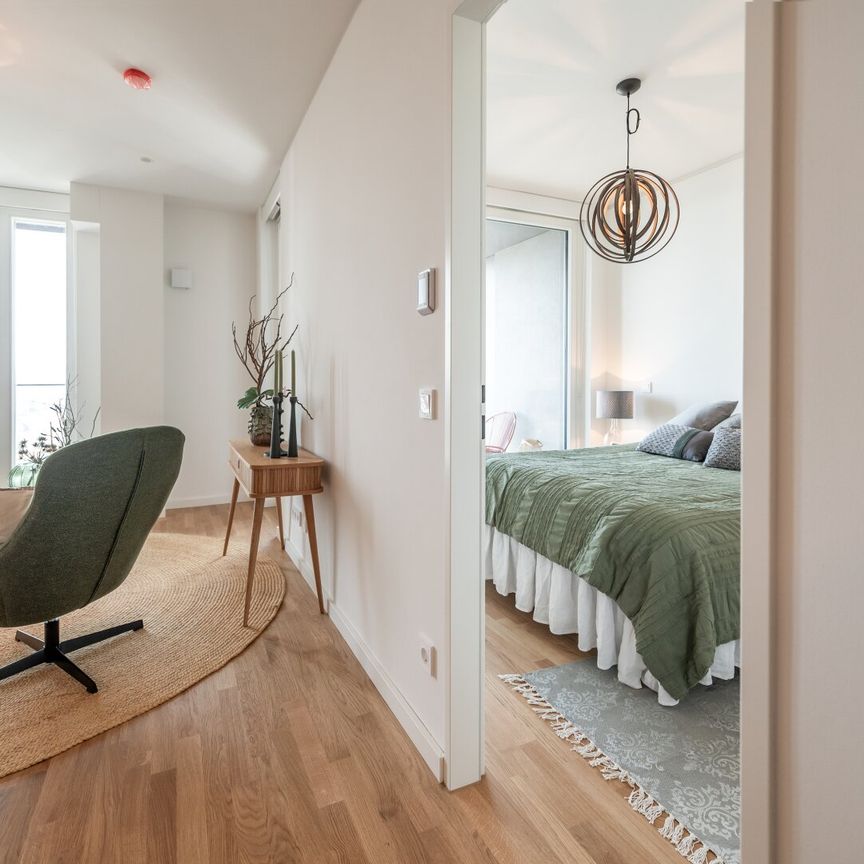 Urbanes Wohnen mit Rooftop Pool, Spa & Skylineblick – TOWER HOMES im V22 - Photo 1