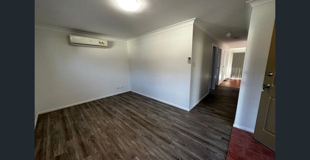 Low Maintenance Three Bedroom Unit in Convenient Location - Photo 1