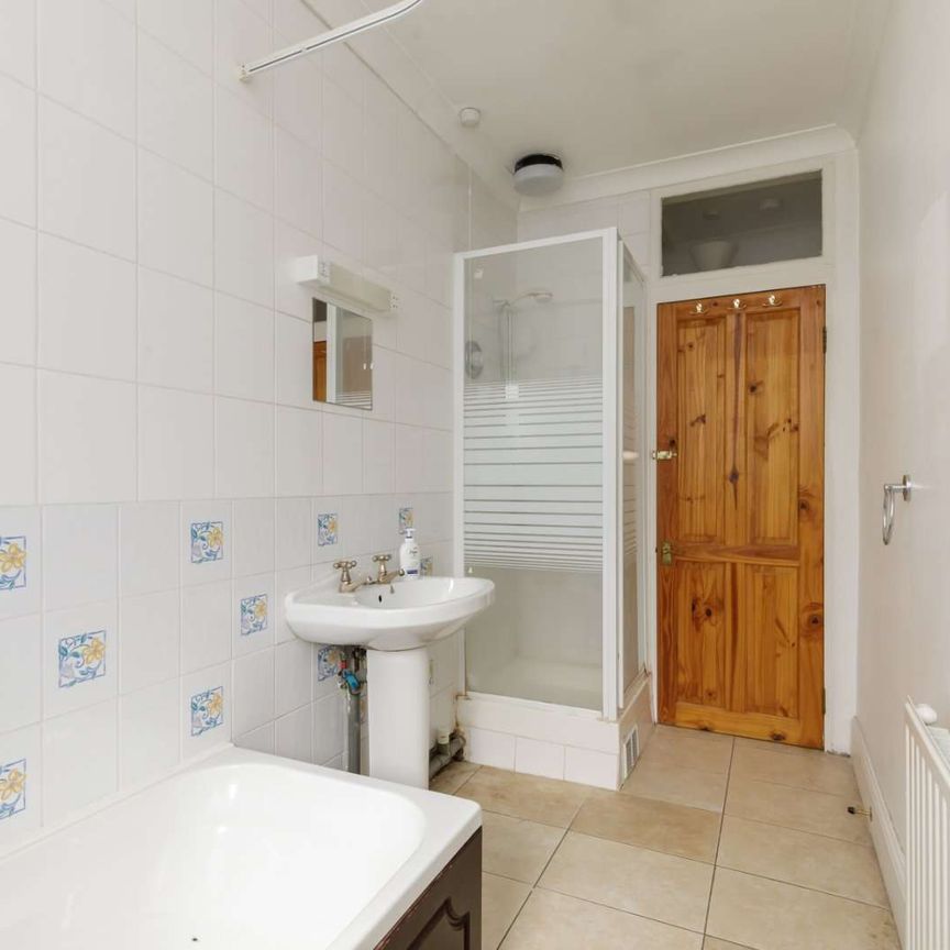 Attractive period conversion property with charm and character located on a popular, tree-lined street. - Photo 1