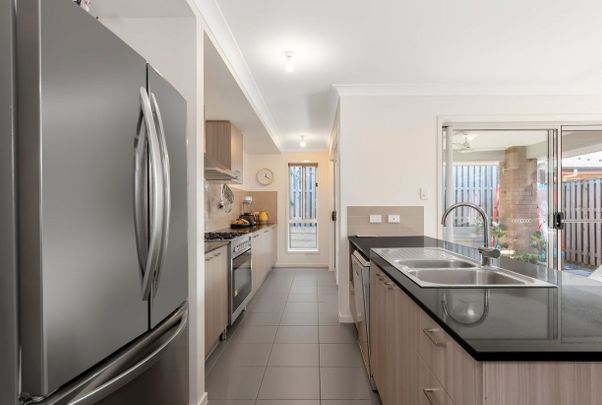 Your Dream Oasis Awaits - Perfectly Positioned in the Gainsborough Greens Estate! - Photo 1