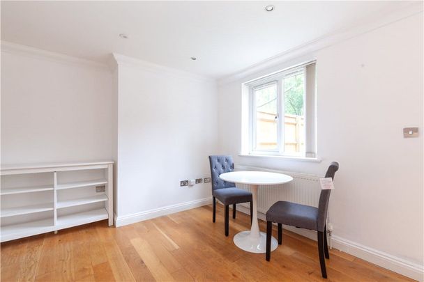 Two bedroom ground floor apartment with private rear garden and parking. - Photo 1