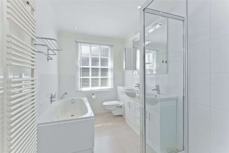 An attractive family home in a highly sought after location within cycling distance of the ACS School (1 mile) and within 1.5 miles from Cobham High Street and station. - Photo 4