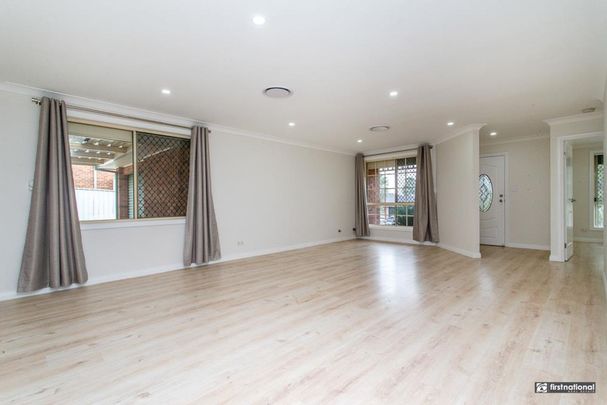 Family Comfort in a Quiet Glenmore Park Cul-de-sac - Photo 1