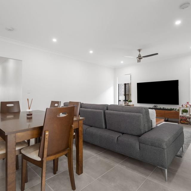 Modern, Secure & Energy-Efficient Home with Solar & A/C Throughout in an Excellent Location - Photo 1