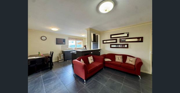 Comfortable Family Living in a Convenient Location - Photo 1