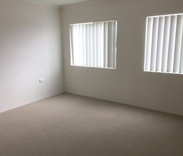 Sunny top floor unit - Photo 3