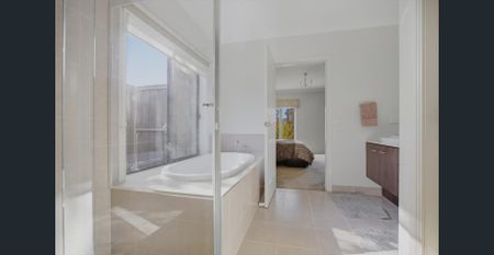 Expansive Family Living with Two Main Bedrooms - Photo 5
