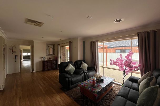Modern 4-Bedroom Home with Multiple Living Areas - Photo 1