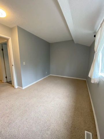 829 Coach Bluff Crescent Southwest — Spacious 3-Bedroom Townhouse in Coach Hill | $2,200 | Available Sept. 1 - Photo 2