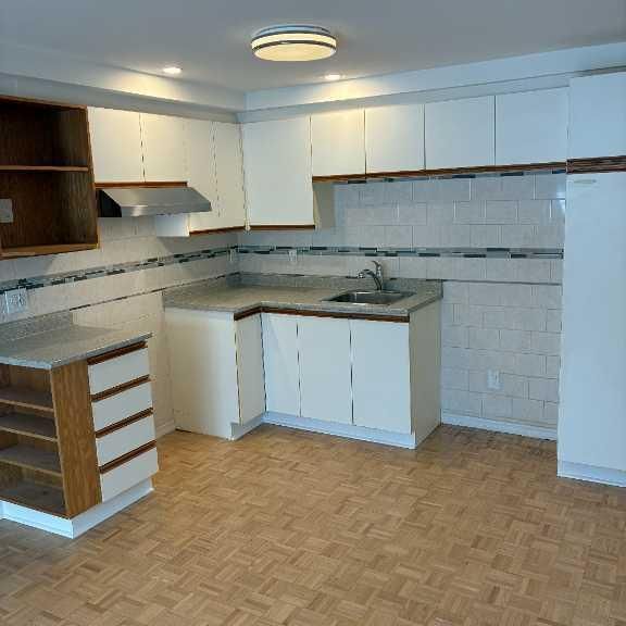 3 ½ en rez-de-jardin dans un Quadplex– Brossard Secteur N – Près du REM et DIX30 - Photo 1