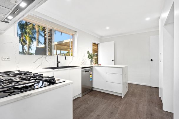 RENOVATED AND READY TO MOVE IN Three Bedroom Residence Close to All Amenities! - Photo 1