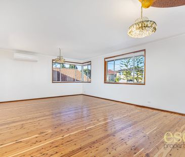Charming Four-Bedroom Home with Garage and Convenient Location - Photo 1